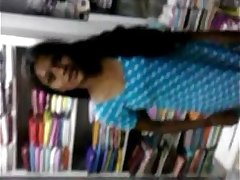 Indian young Student Relaxed on Inside Of book shop - Wowmoyback